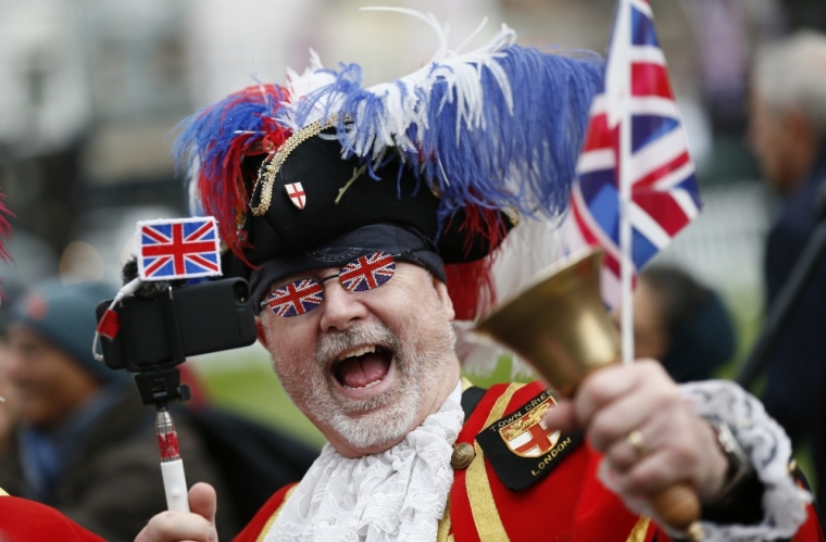 A Royal fan dressed as a Town Crier gathers to celebrate Queen Elizabeth's 90th birthday in Windsor, Britain April 21, 2016.