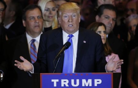 New Jersey Governor Chris Christie (L) and his wife Mary Pat (R) listen as Republican U.S. presidential candidate Donald Trump speaks during Trump's five state primary night event in New York City, U.S., April 26, 2016.