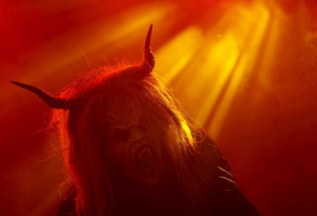 A man dressed as a devil performs during a Krampus show in the southern Bohemian town of Kaplice, December 12, 2015. Each year people in traditional costumes and masks parade through the streets to perform an old ritual to disperse the ghosts of winter.