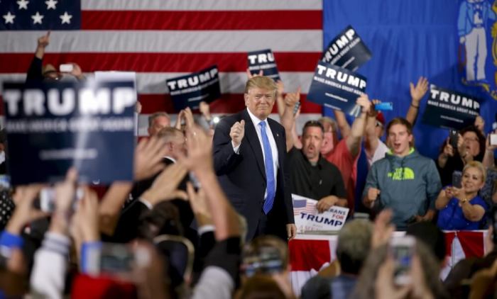 Republican U.S. presidential candidate Donald Trump arrives for a Town Hall in Janesville, Wisconsin, March 29, 2016.