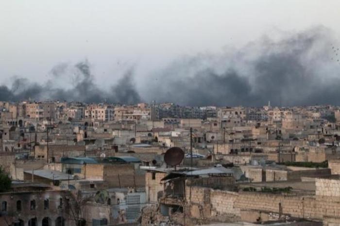 Smoke rises after airstrikes on the rebel-held al-Sakhour neighborhood of Aleppo, Syria. April 29, 2016.