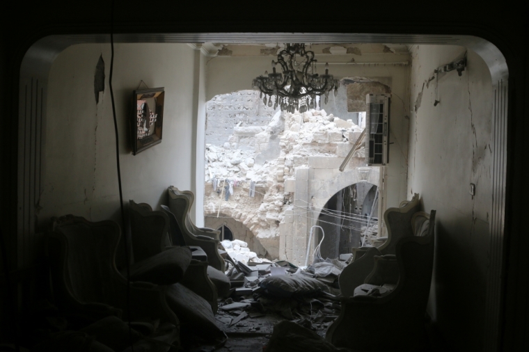 A chandelier hangs in a damaged house in the rebel held area of Old Aleppo, Syria, May 5, 2016.