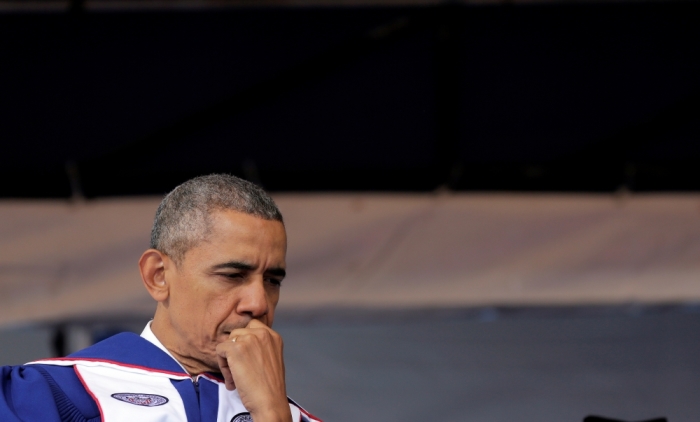 U.S. President Barack Obama waits to deliver the commencement address to the 2016 graduating class of Howard University in Washington, U.S., May 7, 2016.