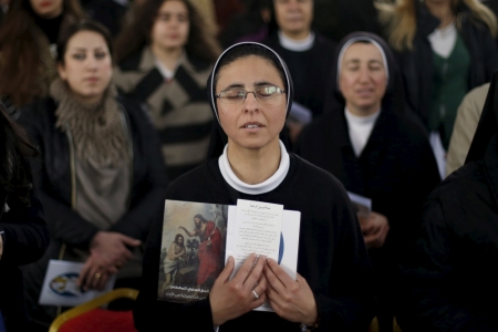 Catholic pilgrims attend mass at John the Baptist Church near the baptism site along the Jordan River, January 8, 2016.