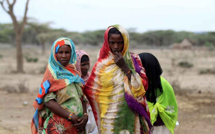 Women wait to receive supplementary food at a distribution centre in Gelcha village, one of the drought stricken areas of Oromia region, in Ethiopia, April 28, 2016.