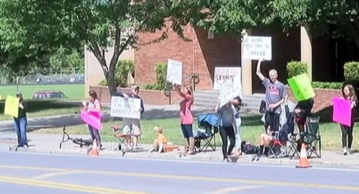 Students from Hedrick Middle School of Medford, Oregon and their parents stage a protest on Monday, May 16, 2016 against President Barack Obama's directive to public schools that they allow transgenders to use the bathroom of their choice.