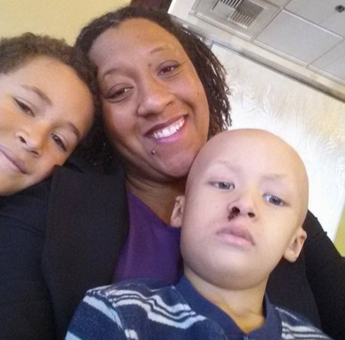 Pastor Brandee Jasmine Mimitzraiem, (C) and her sons.