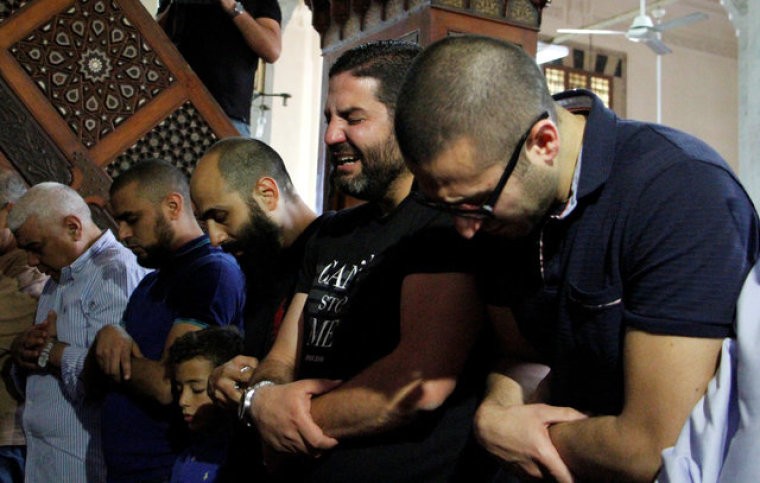 Relatives of the victims of the missing EgyptAir flight MS804 hold an absentee funeral prayer in a mosque nearby Cairo airport, in Cairo, Egypt, May 20, 2016.