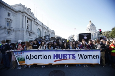 Pro-life demonstrators hold a banner as they prepare to march during the Ninth Annual Walk for Life West Coast rally in San Francisco, California, January 26, 2013. 