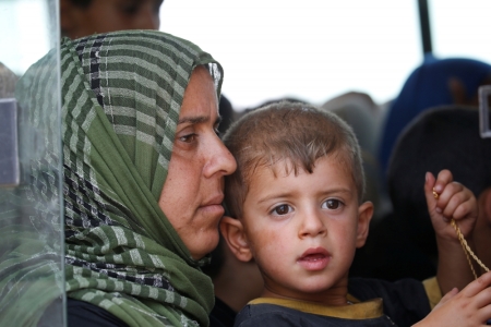 Civilians who fled their homes due to clashes in Saqlawiya transfer to a safe area on the outskirts of Saqlawiya, north of Falluja, Iraq, June 4, 2016.