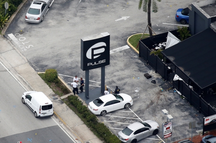 Investigators work the scene following a mass shooting at the Pulse gay nightclub in Orlando Florida, U.S. June 12, 2016.