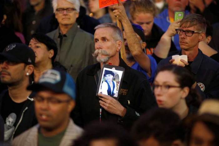 People attend a candlelight vigil for the victims of the Orlando shooting at a gay nightclub, held in San Francisco, California, U.S. June 12, 2016.