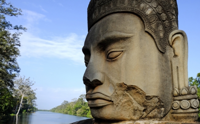 A statue is seen on a stone bridge leading to Angkor Thom, which is part of the Angkor complex that includes the famous temple Angkor Wat, in Siem Reap province, November 22, 2014. Picture taken November 22, 2014.