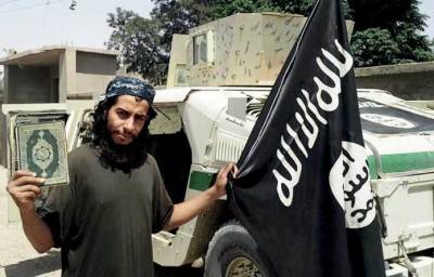 An undated photograph of a man described as Abdelhamid Abaaoud that was published in the Islamic State's online magazine Dabiq and posted on a social media website. A Belgian national currently in Syria and believed to be one of Islamic State's most active operators is suspected of being behind Friday's attacks in Paris, acccording to a source close to the French investigation. 'He appears to be the brains behind several planned attacks in Europe,' the source told Reuters of Abdelhamid Abaaoud, adding he was investigators' best lead as the person likely behind the killing of at least 129 people in Paris on Friday. According to RTL Radio, Abaaoud is a 27-year-old from the Molenbeek suburb of Brussels, home to other members of the militant Islamist cell suspected of having carried out the attacks.