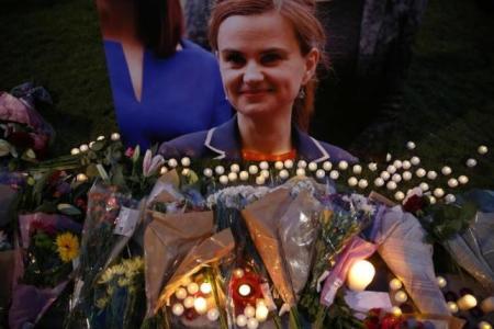 Tributes for Labour Party MP Jo Cox, who was shot dead in the street in northern England, are displayed on Parliament Square in London, Britain, June 16, 2016.