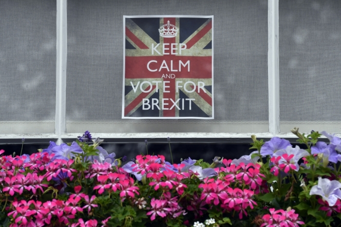 Vote leave posters are seen in a window in Chelsea.