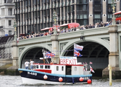 Part of a flotilla of fishing vessels campaigning to leave the European Union sails under Westminster Bridge towards Parliament on the river Thames in London, Britain, June 15, 2016.