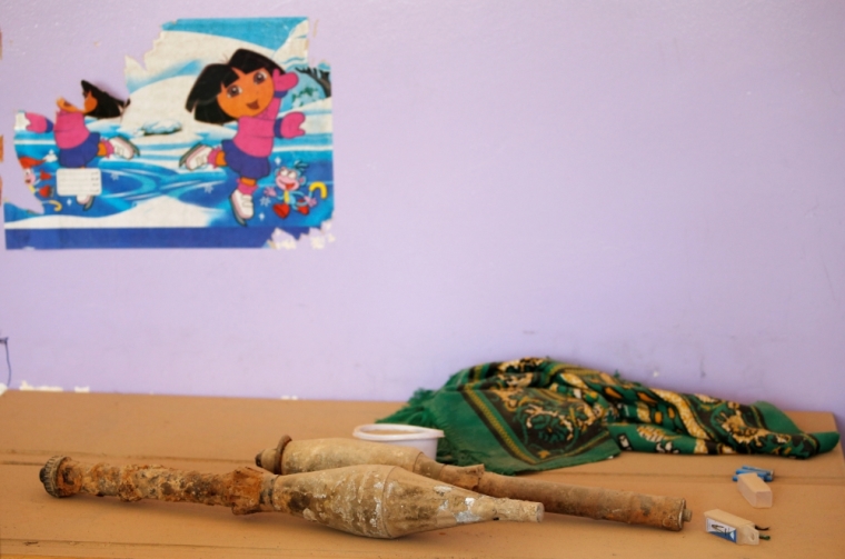 Rocket-propelled grenades left behind by Islamic State militants are seen at a school, following clashes in Falluja, Iraq, June 25, 2016.