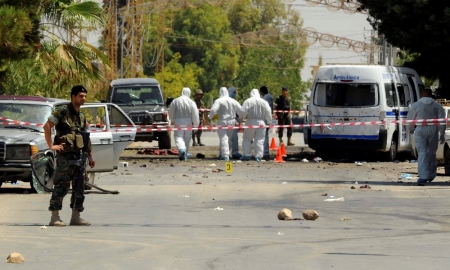 Lebanese army soldiers and forensic inspectors inspect the site where suicide bomb attacks took place in the Christian village of Qaa, in the Bekaa valley, Lebanon, June 27, 2016.