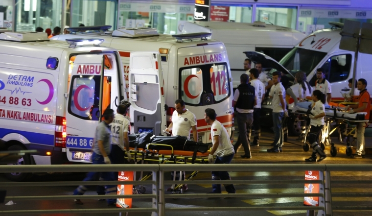 Paramedics push a stretcher at Turkey's largest airport, Istanbul Ataturk, Turkey, following a blast June 28, 2016.