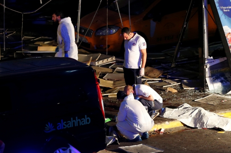 Forensic experts work outside Turkey's largest airport, Istanbul Ataturk, Turkey, following a blast, June 28, 2016.