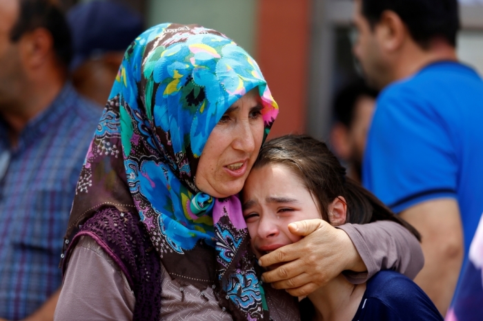 Relatives of one of the victims of yesterday's blast at Istanbul Ataturk Airport mourn in front of a morgue in Istanbul, Turkey, June 29, 2016.