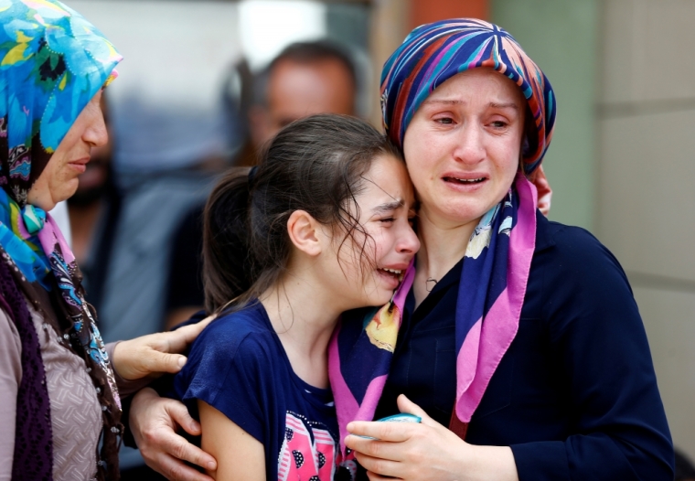 Relatives of one of the victims of yesterday's blast at Istanbul Ataturk Airport mourn in front of a morgue in Istanbul, Turkey, June 29, 2016.