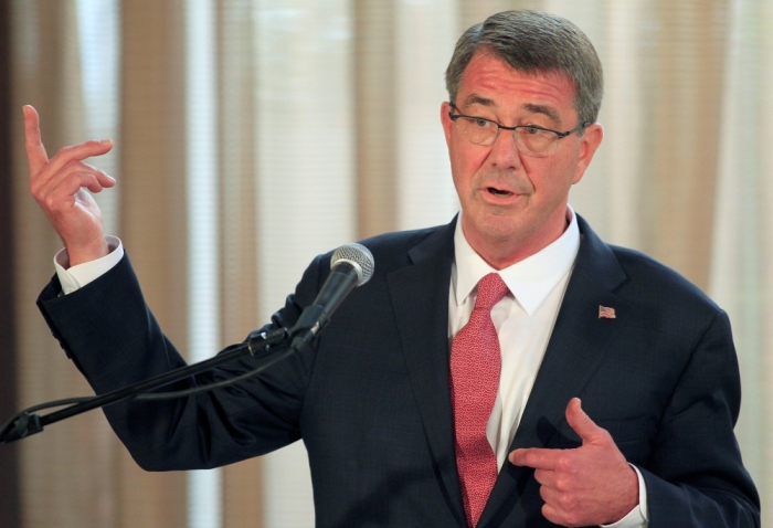 Visiting U.S. Defense Secretary Ash Carter gestures during a joint press conference with his Filipino counterpart Voltaire Gazmin (not pictured) at the presidential palace in Manila April 14, 2016.