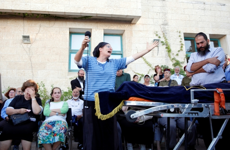 The mother of Israeli girl, Hallel Yaffa Ariel, 13, who was killed in a Palestinian stabbing attack in her home in the West Bank Jewish settlement of Kiryat Arba, mourns during her funeral at a cemetery in the West Bank city of Hebron June 30, 2016.