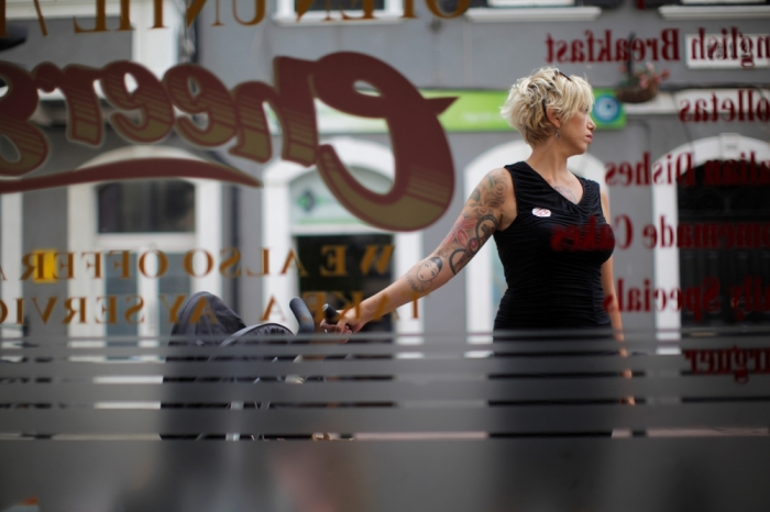 A woman wears the sticker 'I'm in' on her shirt outside a bar during the EU referendum in the British overseas territory of Gibraltar, historically claimed by Spain, June 23, 2016.