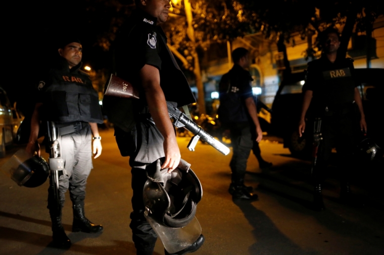 Security personnel keep watch, after gunmen stormed the Holey Artisan restaurant and took hostages, in the Gulshan area of Dhaka, Bangladesh, July 2, 2016.