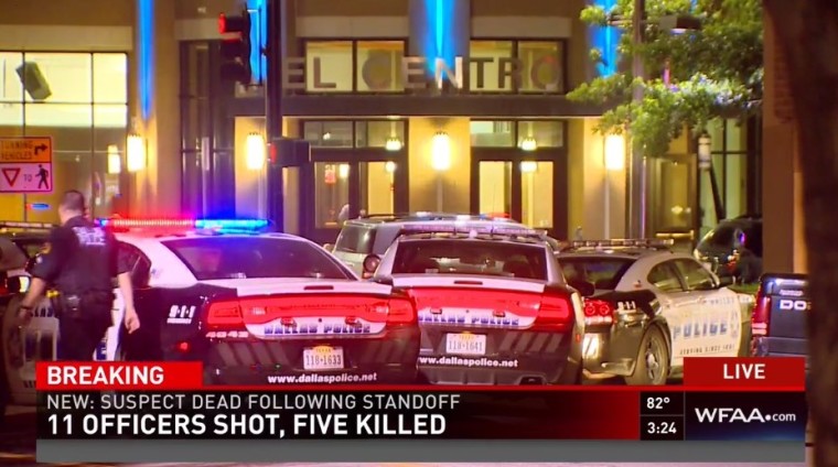 Police outside El Centro Community College in downtown Dallas searching for suspicious packages amid threats from one suspect who claimed that bombs were planted throughout the parking garage before he killed himself during a standoff with officers on July 8, 2016.