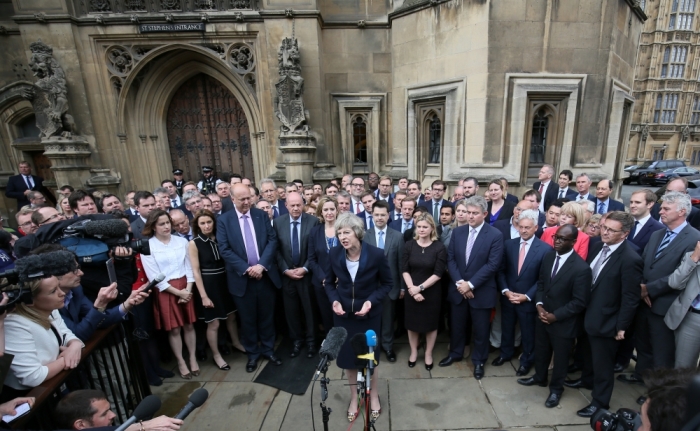 Theresa May speaks to reporters after being confirmed as the leader of the Conservative Party and Britain's next Prime Minister outside the Houses of Parliament in Westminster, central London, July 11, 2016.