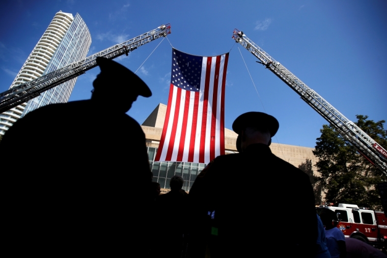 Police officers attend a memorial service following the multiple police shootings in Dallas, Texas, July 12, 2016.