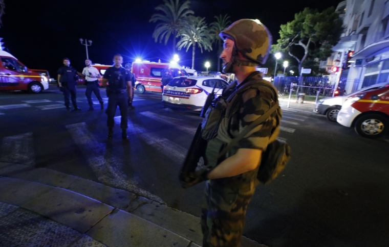 French soldiers cordon the area after at least 30 people were killed in Nice, France, when a truck ran into a crowd celebrating the Bastille Day national holiday, July 14, 2016.