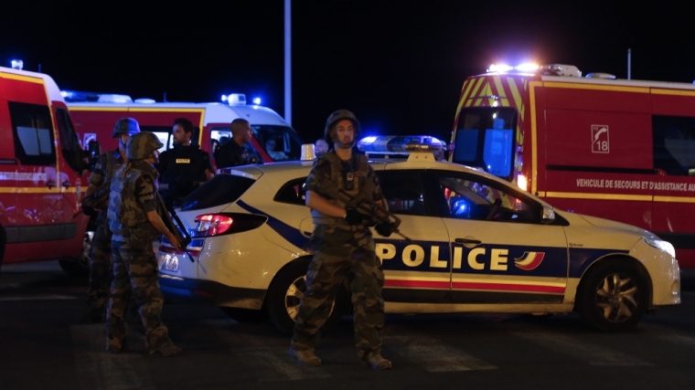 French soldiers and rescue forces are seen at the scene whare at least 30 people were killed in Nice, France, when a truck ran into a crowd celebrating the Bastille Day national holiday July 14, 2016.