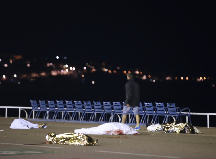 Bodies are seen on the ground July 15, 2016 after at least 30 people were killed in Nice, France, when a truck ran into a crowd celebrating the Bastille Day national holiday July 14.