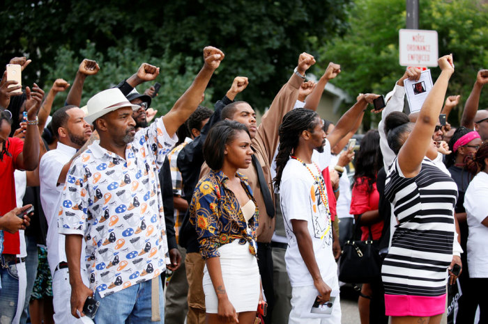 Attendees and the funeral procession for Philando Castile travel from the St Paul Cathedral in St Paul, Minnesota, U.S. July 14, 2016.