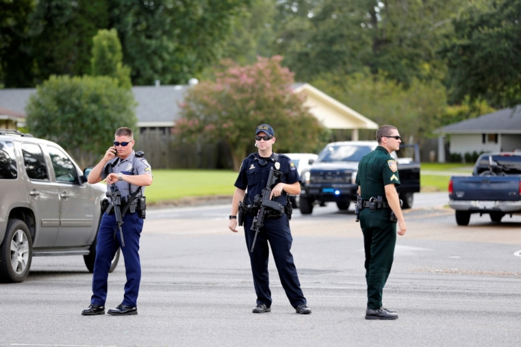 Police officers block off a road after a shooting of police in Baton Rouge, Louisiana, U.S. July 17, 2016.