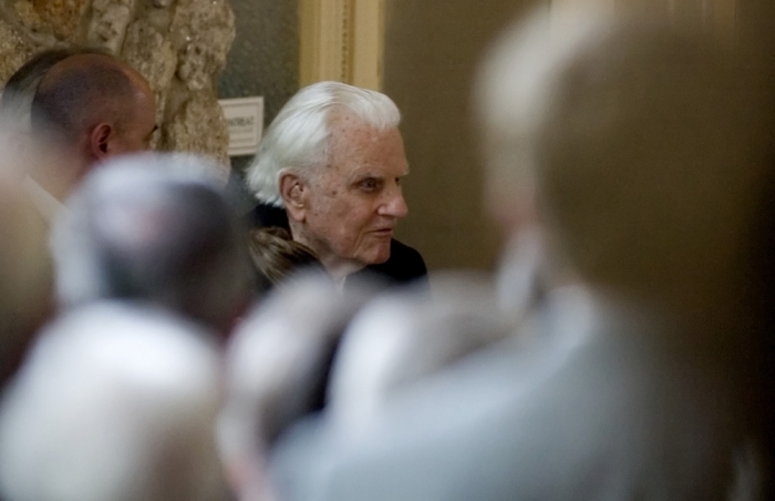 Billy Graham walks to his seat before his wife Ruth Bell Graham's funeral in Anderson Auditorium on the campus of the Montreat Conference Center in North Carolina on June 16, 2007.