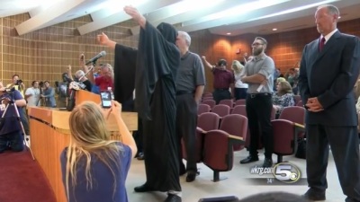 David Suhor gives a Satanic invocation at a city council meeting in Pensacola, Florida on July 14, 2016.