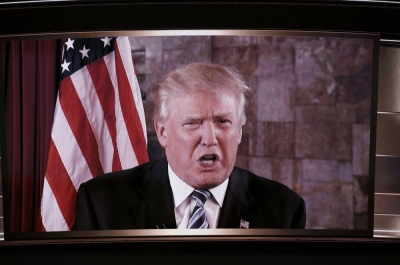 U.S. Republican Presidential Nominee Donald Trump is shown on a video monitor as he speaks live to the crowd from New York at the Republican National Convention in Cleveland, Ohio, U.S. July 19, 2016.