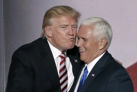 Republican U.S. presidential nominee Donald Trump (L) greets vice presidential nominee Mike Pence after Pence spoke at the Republican National Convention in Cleveland, Ohio, U.S. July 20, 2016.