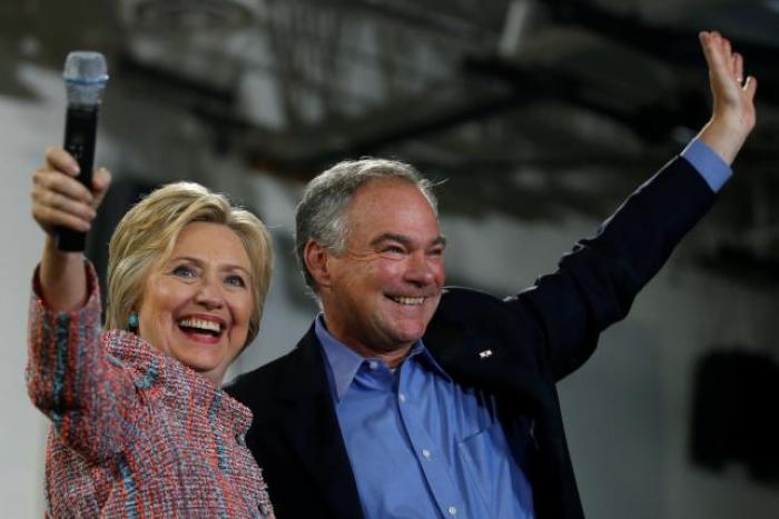 Democratic U.S. presidential candidate Hillary Clinton and U.S. Senator Tim Kaine (D-VA) wave to the crowd during a campaign rally at Ernst Community Cultural Center in Annandale, Virginia, U.S., July 14, 2016.