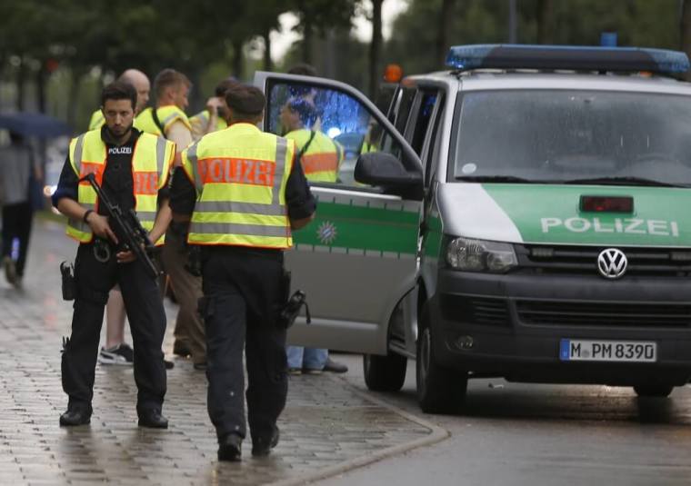 Police secure a street near to the scene of a shooting in Munich, Germany, July 22, 2016.