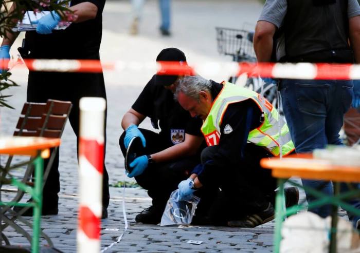 Police secure the area after an explosion in Ansbach, Germany, July 25, 2016.