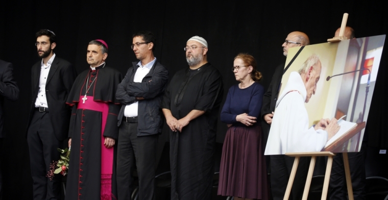 Archbishop of Rouen and Primate of Normandy Mgr Dominique Lebrun (2ndL) stands on stage in Saint-Etienne-du-Rouvray, near Rouen, France, during a tribute July 28, 2016 to French priest, Father Jacques Hamel, killed on Tuesday in an attack on the church that was carried out by assailants linked to Islamic State.