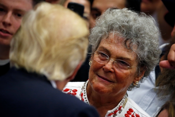 Republican presidential nominee Donald Trump speaks to a supporter as he works the ropeline at a campaign rally in Colorado Springs, Colorado, U.S., July 29, 2016.