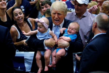 Republican presidential nominee Donald Trump holds babies at a campaign rally in Colorado Springs, Colorado, U.S., July 29, 2016.