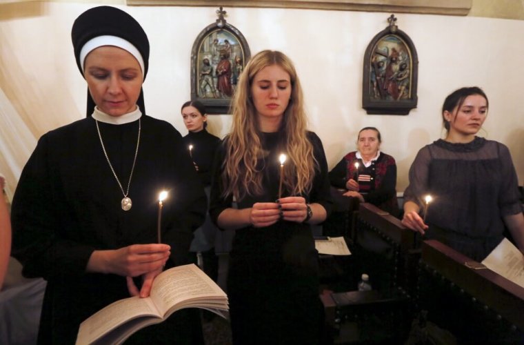 Believers attend a service at a Roman Catholic church on the eve of Easter Sunday in Krasnoyarsk, Siberia, Russia, March 26, 2016. Picture taken March 26, 2016.